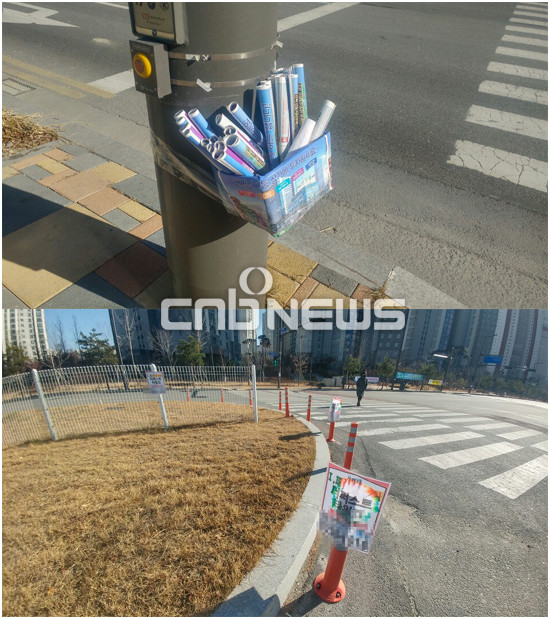 도보와 차도 곳곳에는 분양·상가임대와 관련된 광고 전단지를 쉽게 확인할 수 있다. (사진=손강훈 기자)